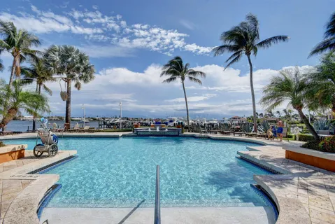 a view of a swimming pool and lounge chair