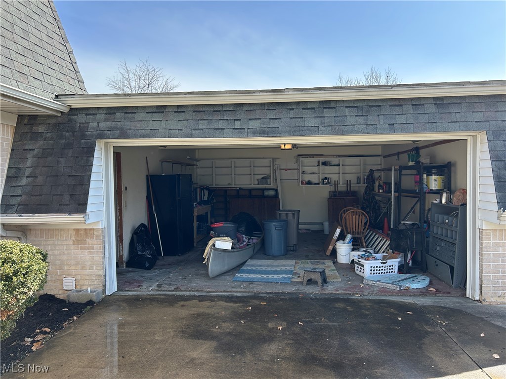 424 Ridge Road North North Fairfield, OH 44855 - Photo 18 of 48 Garage featuring driveway