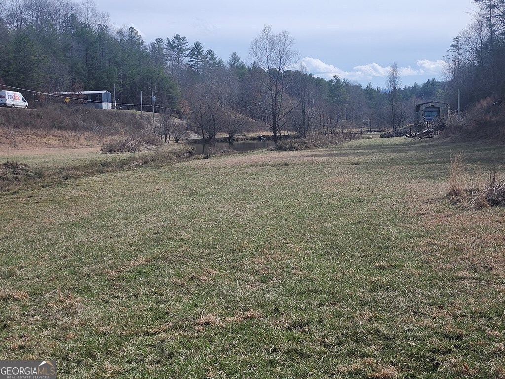 31.53-acres Barnett Road Murphy, NC 28906 - Photo 9 of 23 a backyard of a house with table and chairs