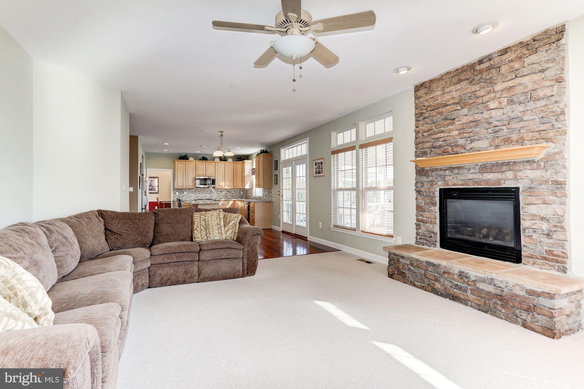 15115 Red Ridge Place Bowie, MD 20715 - Photo 11 of 30 Family room has stunning stone fireplace
