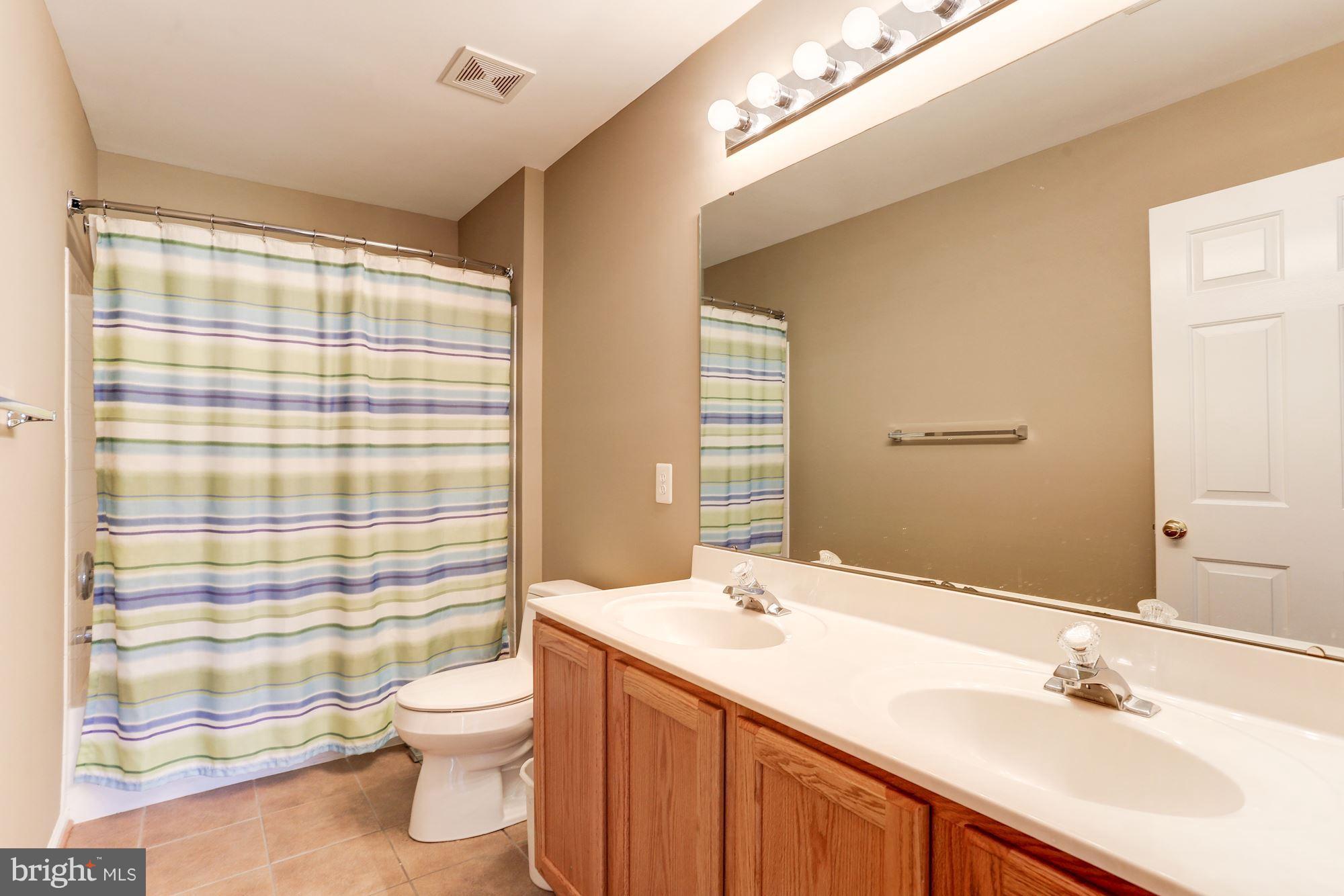 15115 Red Ridge Place Bowie, MD 20715 - Photo 21 of 30 Upper level hall bath with double sinks