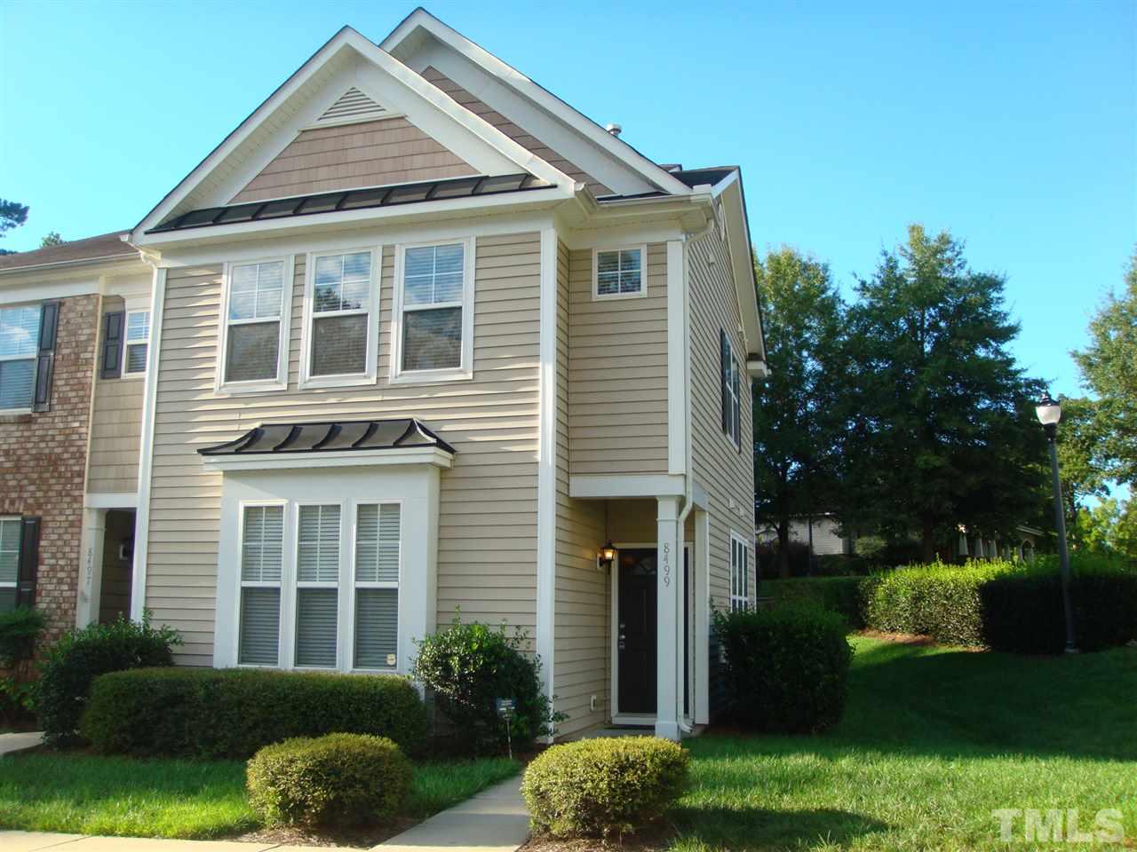 8499 Central Drive Raleigh, NC 27613 - Photo 1 of 4 a front view of a house with garden