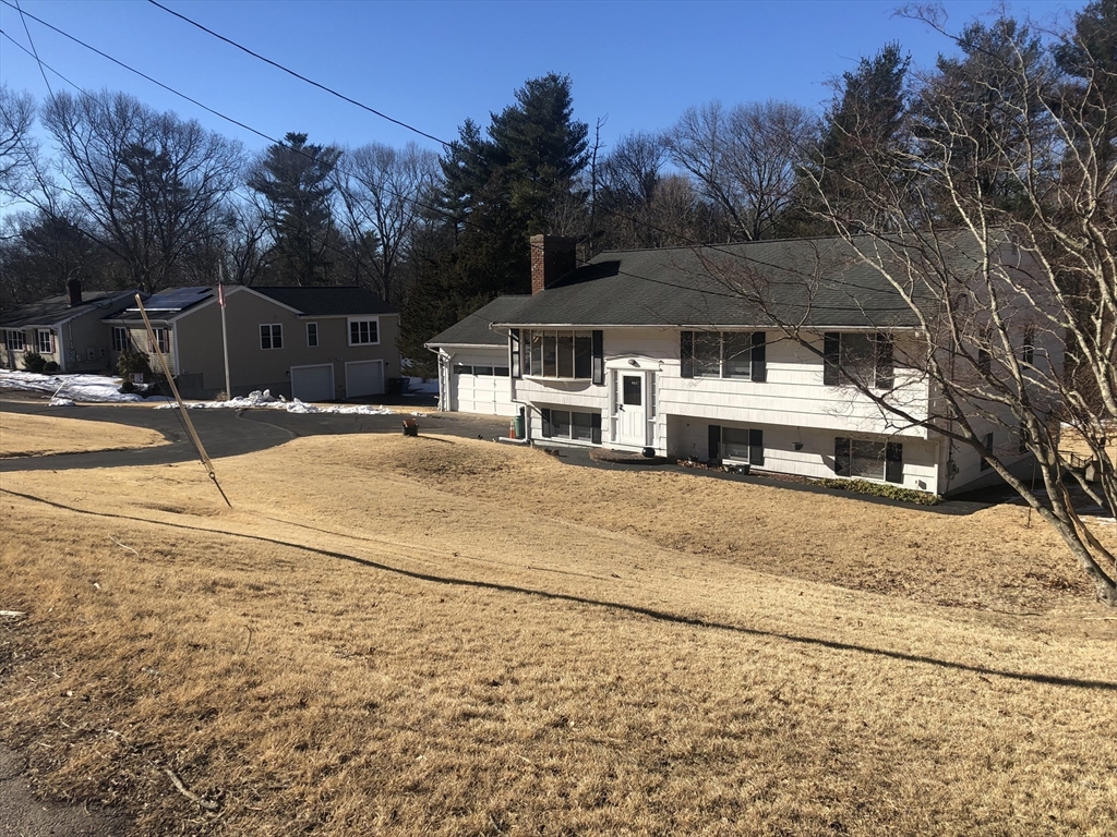 521 Franklin Street Whitman, MA 02382 - Photo 2 of 30 a front view of a house with a yard