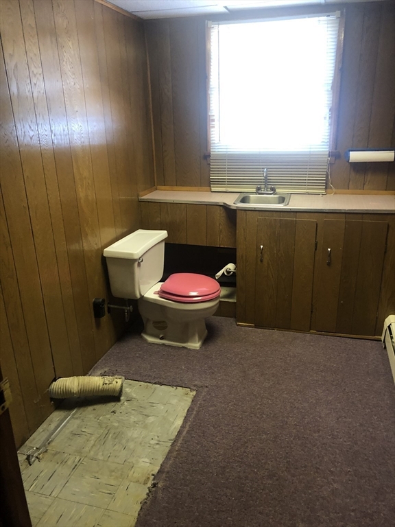 521 Franklin Street Whitman, MA 02382 - Photo 25 of 30 a bathroom with a sink toilet vanity and window