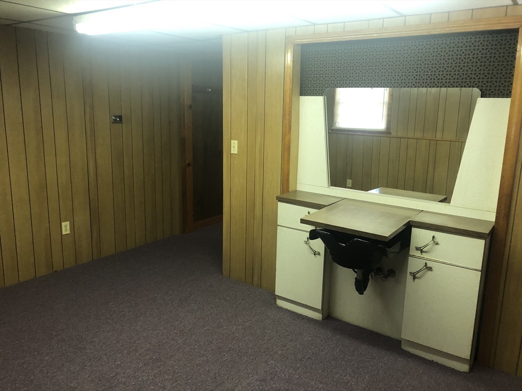 521 Franklin Street Whitman, MA 02382 - Photo 26 of 30 a bathroom with a sink a mirror and a toilet