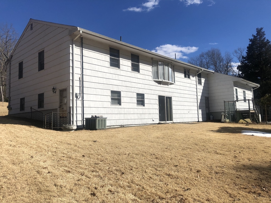 521 Franklin Street Whitman, MA 02382 - Photo 3 of 30 a view of a white house with a yard