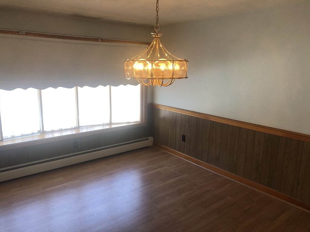 521 Franklin Street Whitman, MA 02382 - Photo 9 of 30 a view of empty room with window