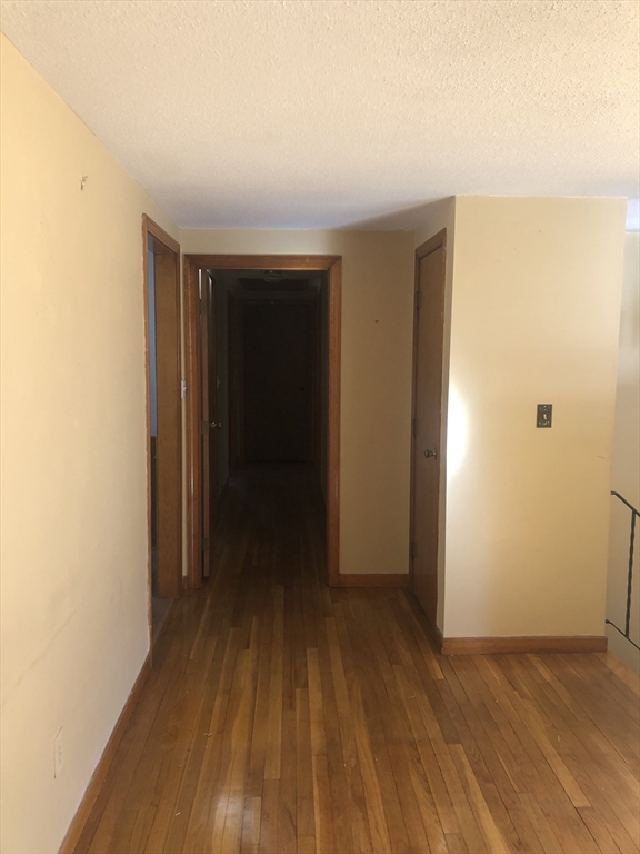 521 Franklin Street Whitman, MA 02382 - Photo 10 of 30 a view of hallway with wooden floor