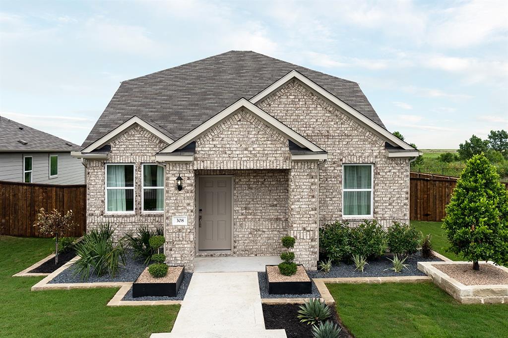 308 Stinchcomb Road Hutto, TX 78634 - Photo 1 of 14 View of front of house with brick siding and a shingled roof