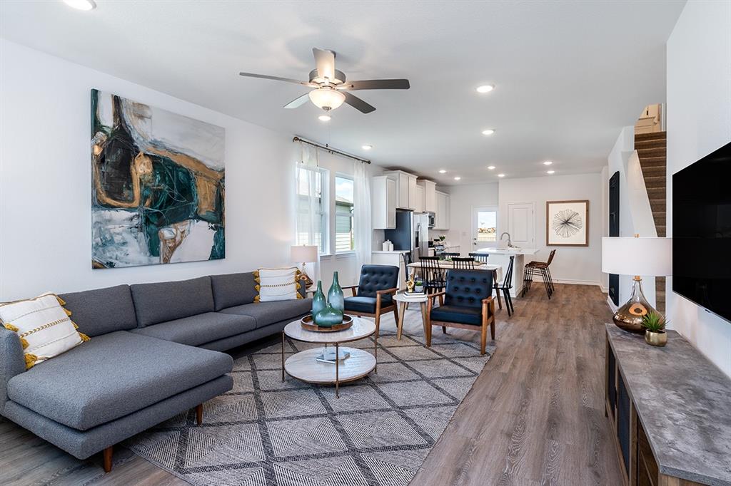 308 Stinchcomb Road Hutto, TX 78634 - Photo 2 of 14 Living area with a ceiling fan, dark wood-style floors, and recessed lighting
