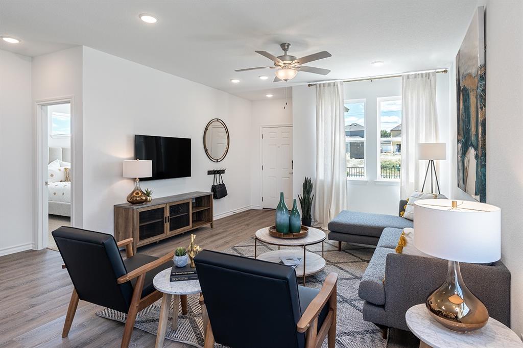 308 Stinchcomb Road Hutto, TX 78634 - Photo 3 of 14 Living room with wood finished floors, ceiling fan, and recessed lighting
