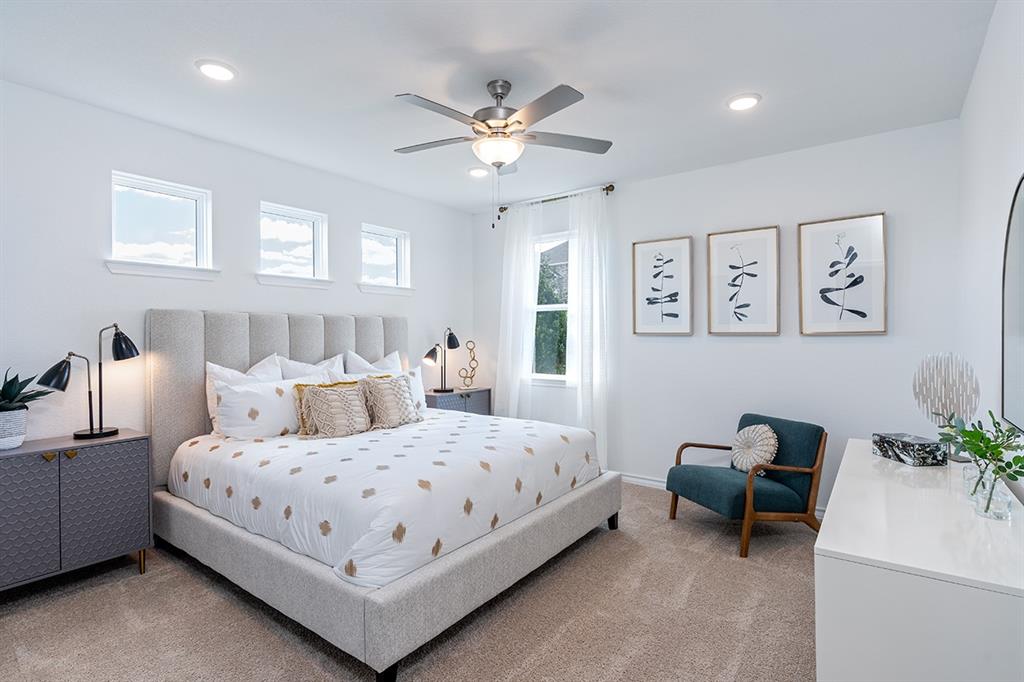 308 Stinchcomb Road Hutto, TX 78634 - Photo 4 of 14 Carpeted bedroom featuring a ceiling fan and recessed lighting