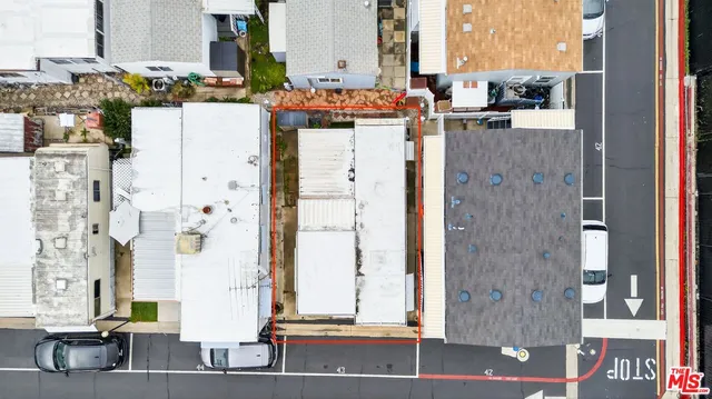 a view of living room with furniture and large windows