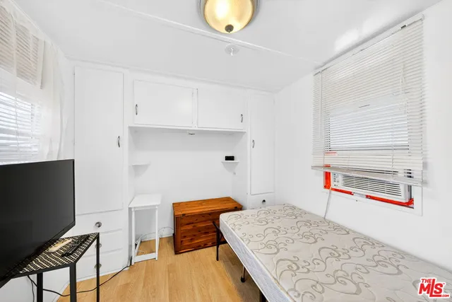 a room with furniture and a wooden floor