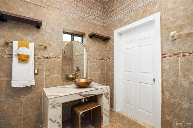 a bathroom with a sink and a mirror