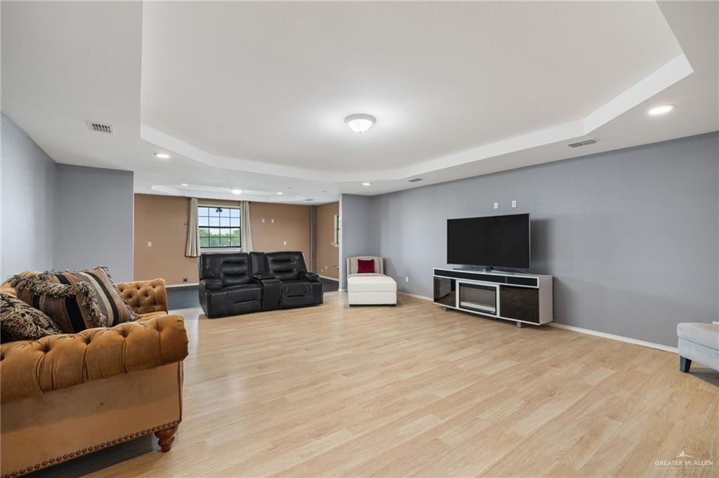 5056 Mile 8 Road Edinburg, TX 78541 - Photo 20 of 34 a living room with furniture and a flat screen tv