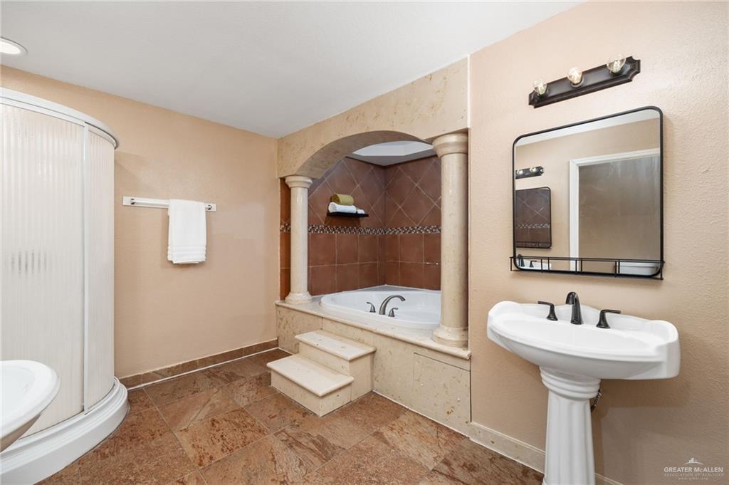 5056 Mile 8 Road Edinburg, TX 78541 - Photo 23 of 34 a bathroom with a sink a toilet and mirror