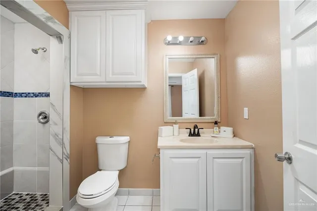 a large bed sitting in a room next to a window