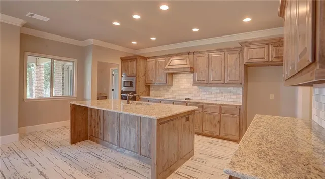 a kitchen with a sink stove and cabinets