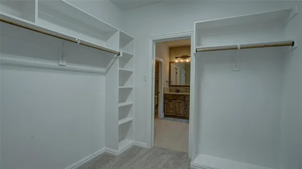 a view of an empty walk in closet