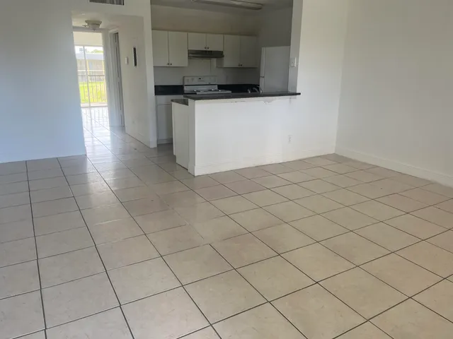 a kitchen with stainless steel appliances a sink and cabinets