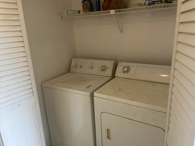 a utility room with dryer and washer