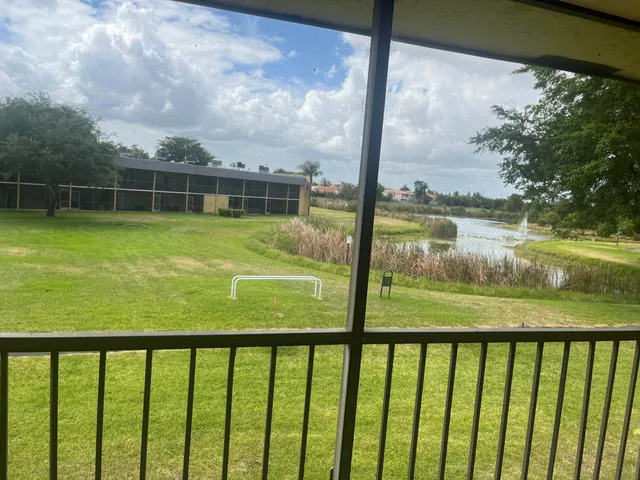a view of swimming pool from a balcony