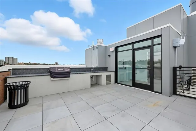 a view of a street with a building and trees