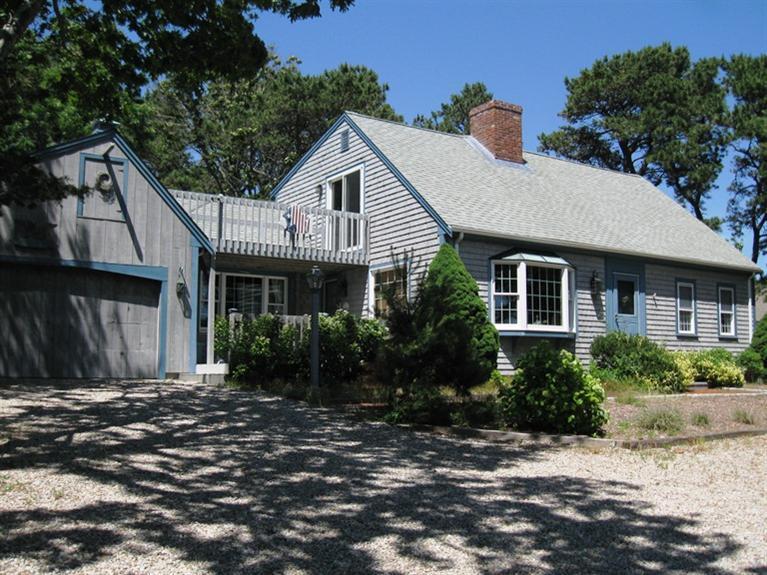 1250 Samoset Road Eastham, MA 02642 - Photo 1 of 29 a front view of a house with a yard
