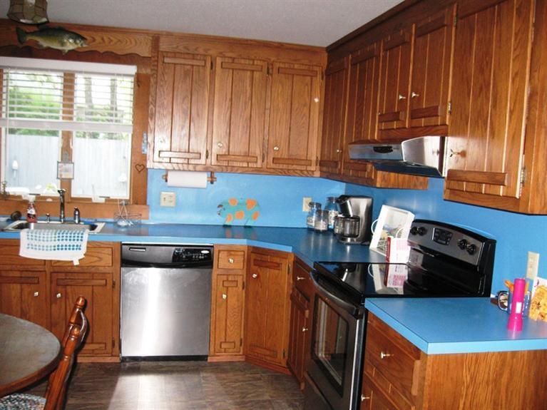 1250 Samoset Road Eastham, MA 02642 - Photo 13 of 29 a kitchen with stainless steel appliances granite countertop a stove a sink and a microwave