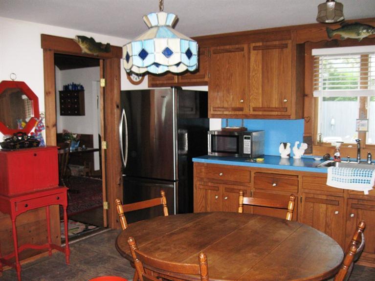 1250 Samoset Road Eastham, MA 02642 - Photo 14 of 29 a kitchen with stainless steel appliances granite countertop a refrigerator a stove and a sink