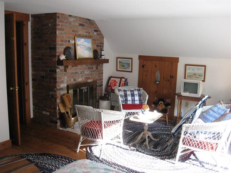 1250 Samoset Road Eastham, MA 02642 - Photo 15 of 29 a living room with furniture and a fireplace
