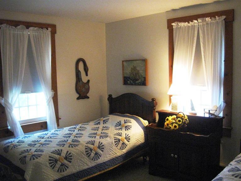 1250 Samoset Road Eastham, MA 02642 - Photo 22 of 29 a bedroom with bed and a window