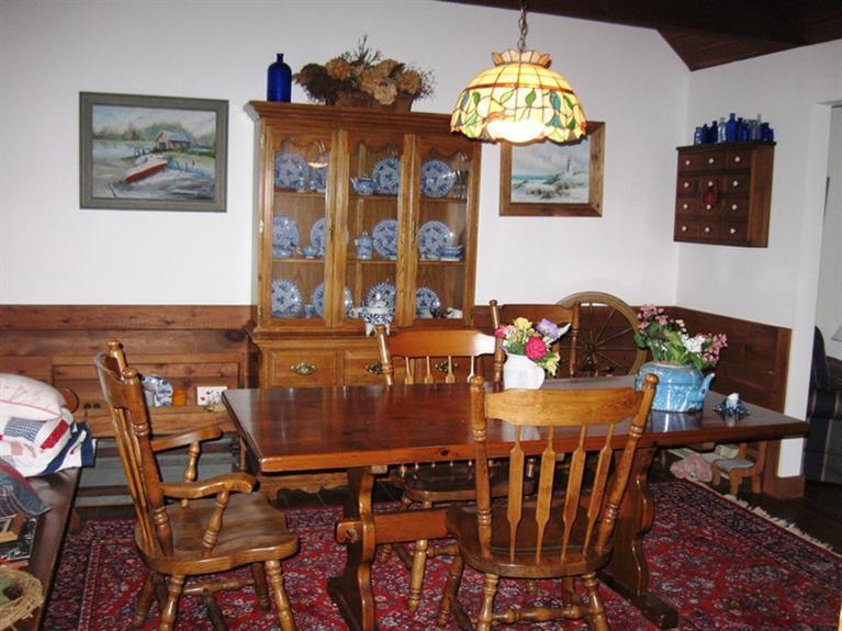 1250 Samoset Road Eastham, MA 02642 - Photo 3 of 29 a view of a dining room with furniture wooden floor and chandelier
