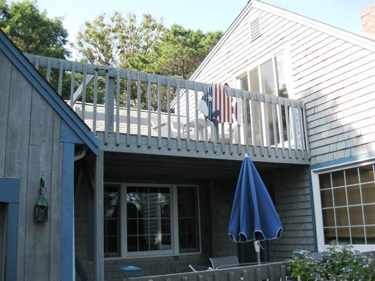 1250 Samoset Road Eastham, MA 02642 - Photo 4 of 29 a front view of a house with balcony