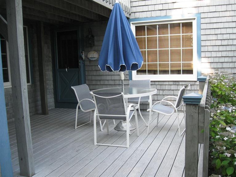 1250 Samoset Road Eastham, MA 02642 - Photo 8 of 29 a view of a chairs and table on the wooden floor