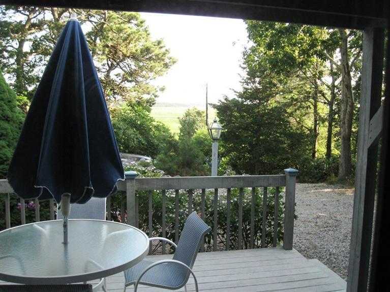 1250 Samoset Road Eastham, MA 02642 - Photo 9 of 29 a balcony with table and chairs
