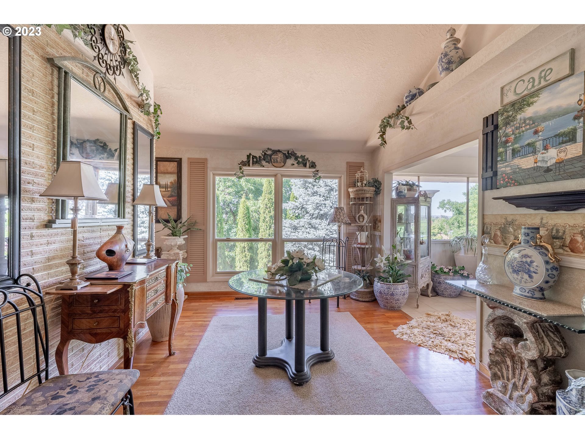 12750 Clow Corner Road Dallas, OR 97338 - Photo 12 of 43 a living room with fireplace furniture and a large window