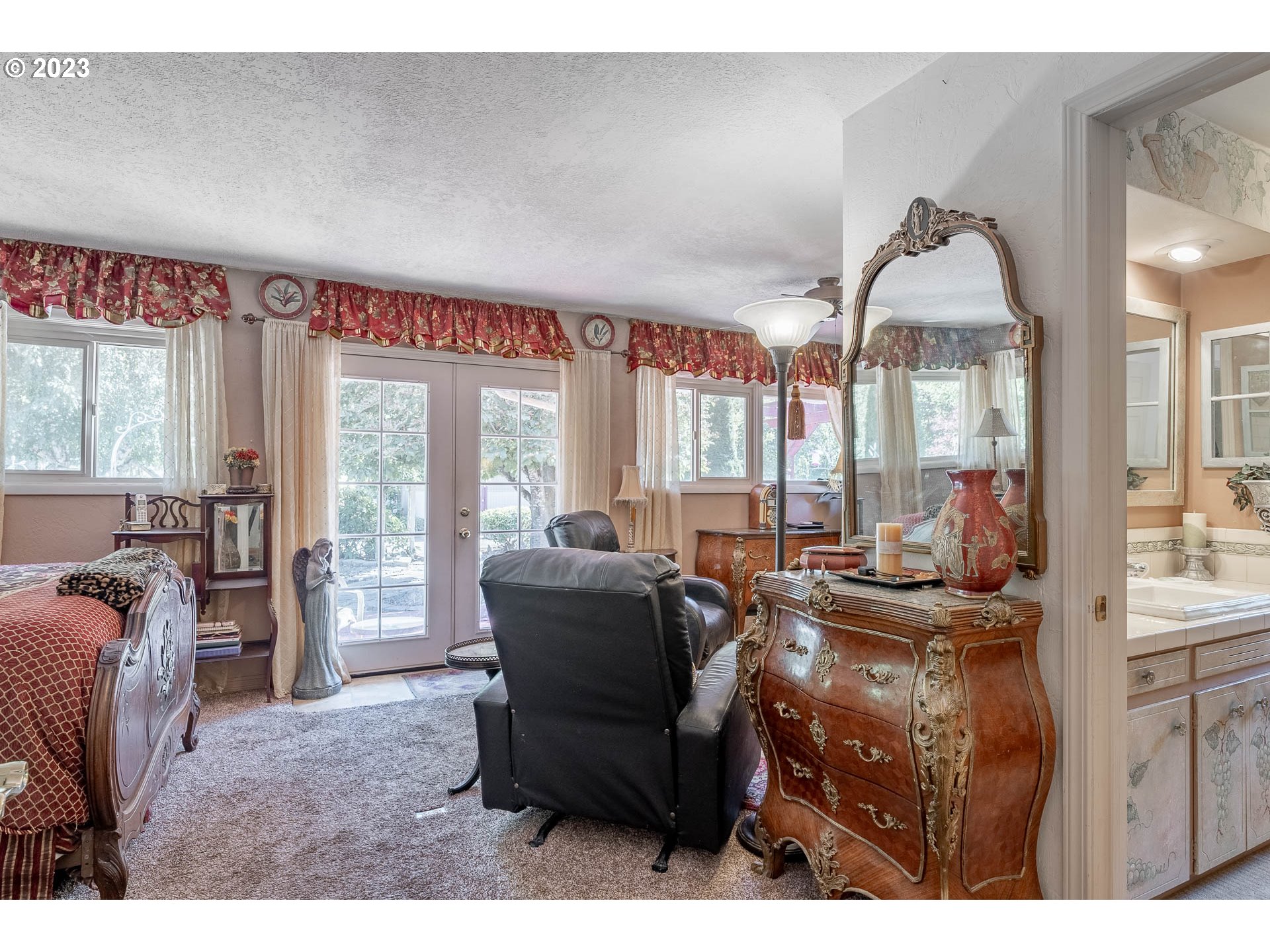 12750 Clow Corner Road Dallas, OR 97338 - Photo 22 of 43 a living room with furniture a large window and wooden floor