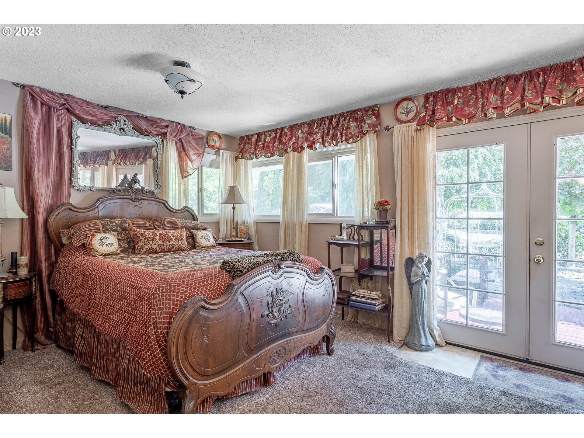 12750 Clow Corner Road Dallas, OR 97338 - Photo 23 of 43 a bedroom with a large bed and a window