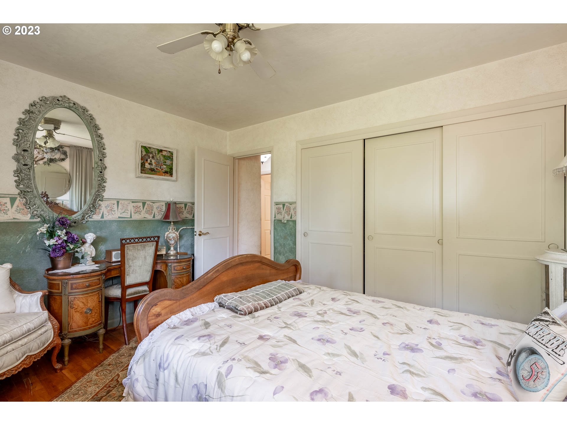 12750 Clow Corner Road Dallas, OR 97338 - Photo 28 of 43 a bedroom with a bed a mirror and lamp