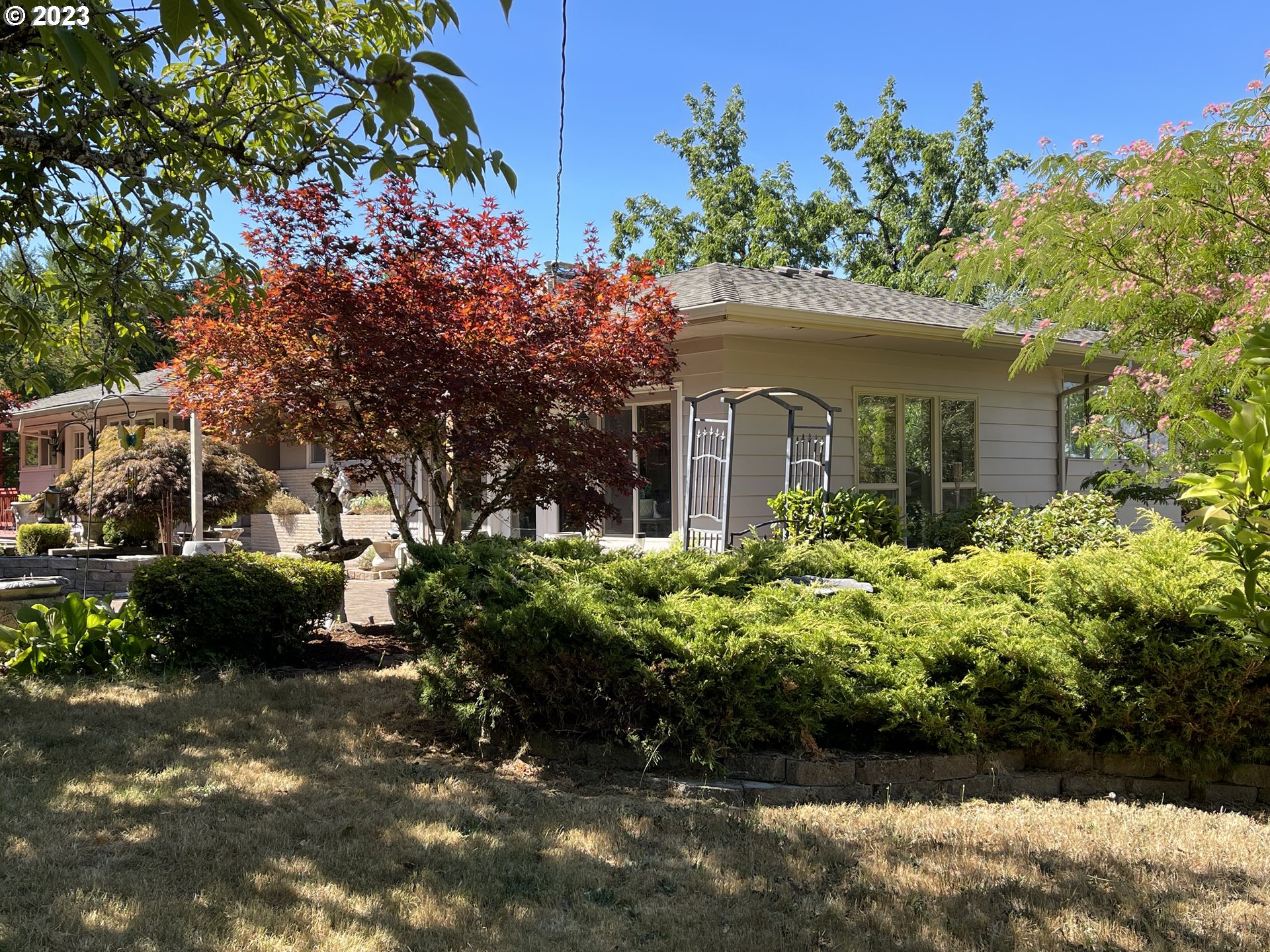 12750 Clow Corner Road Dallas, OR 97338 - Photo 3 of 43 a front view of a house with a yard