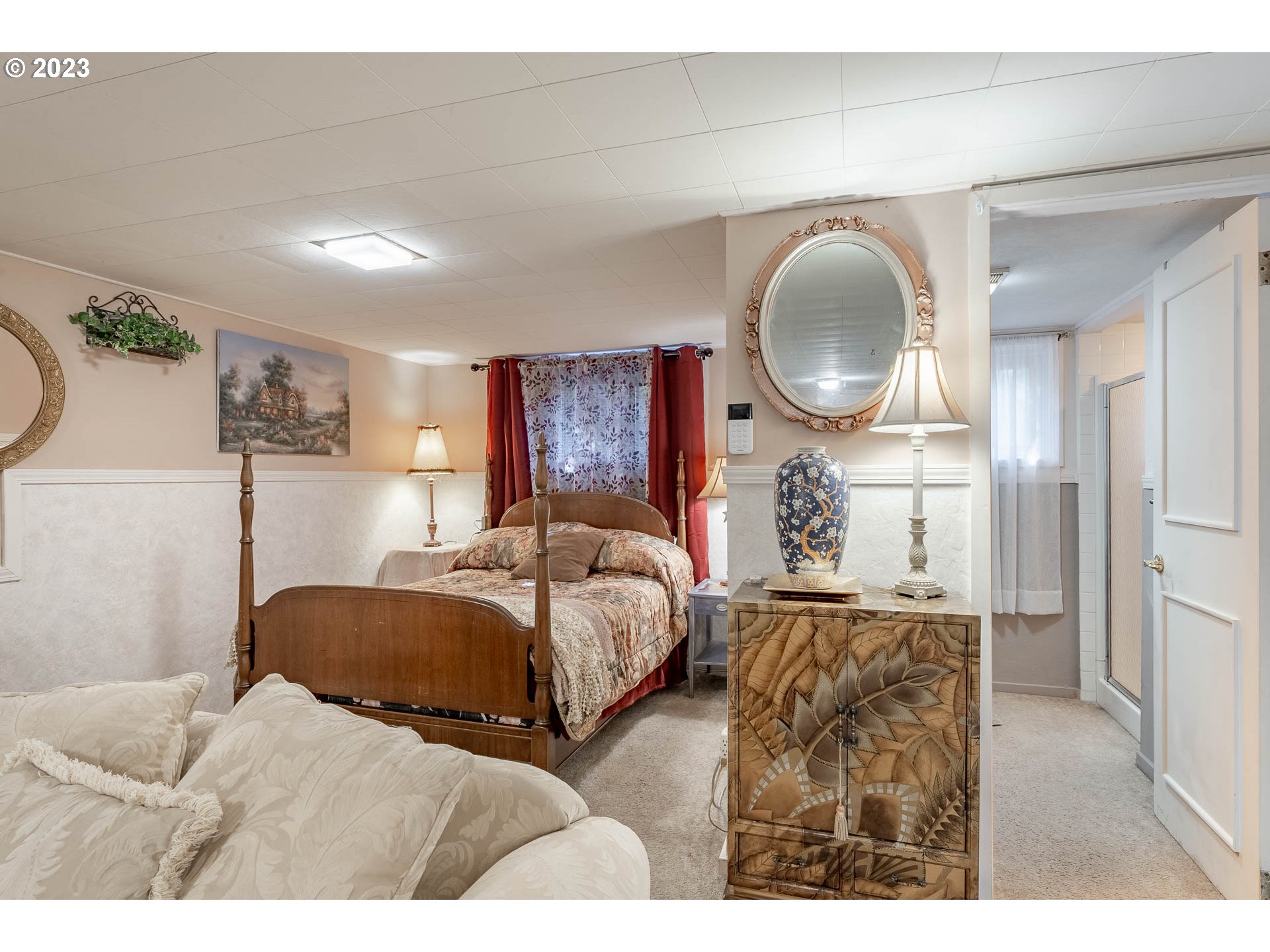 12750 Clow Corner Road Dallas, OR 97338 - Photo 33 of 43 a bedroom with a bed mirror and vanity