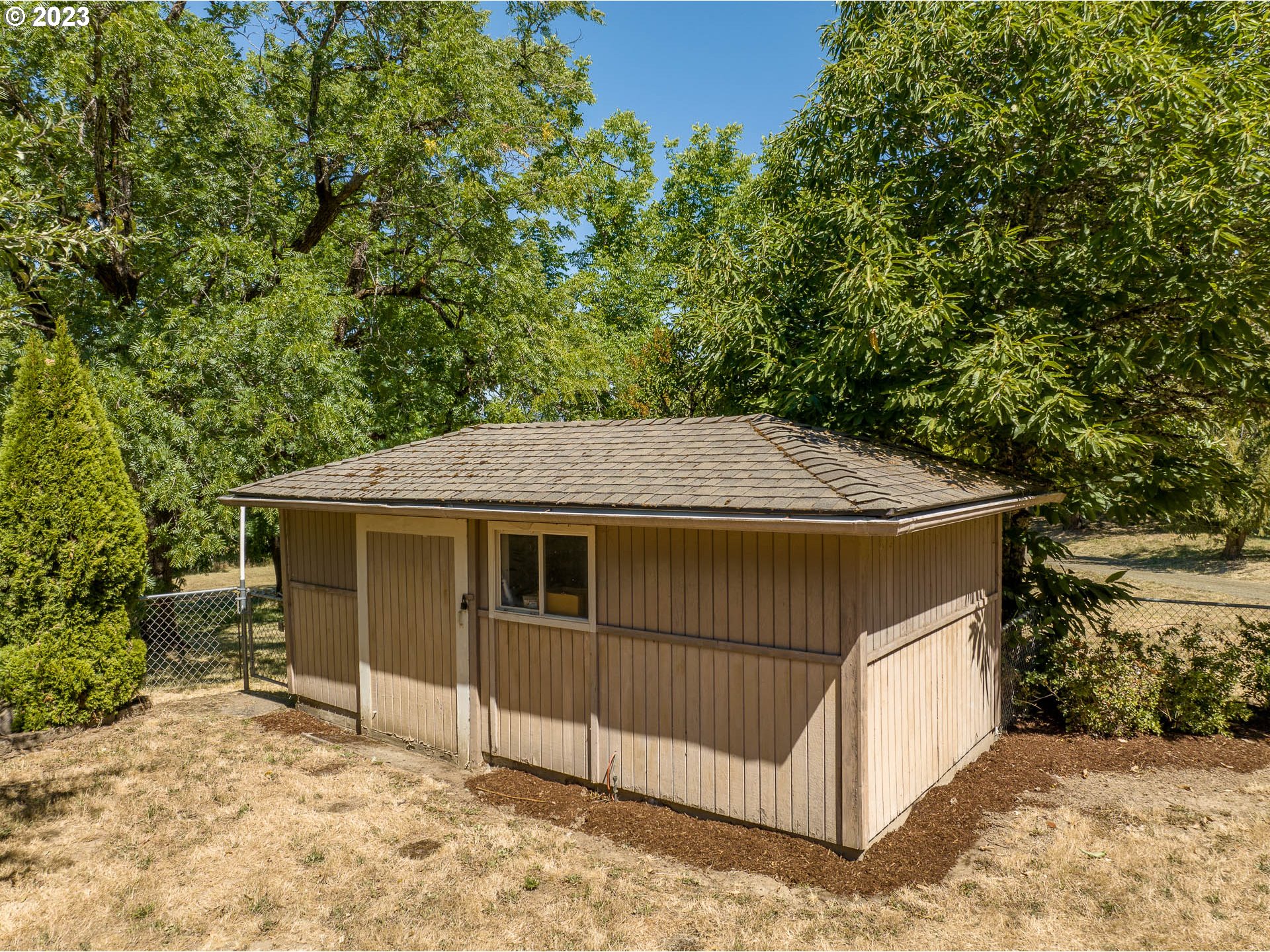 12750 Clow Corner Road Dallas, OR 97338 - Photo 39 of 43 a view of a house with a yard and garage