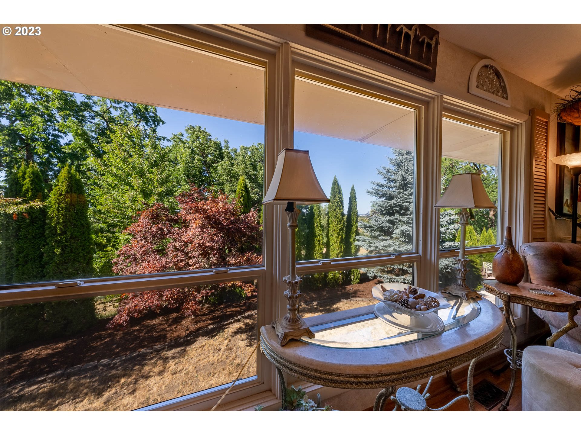 12750 Clow Corner Road Dallas, OR 97338 - Photo 10 of 43 a view of a patio with table and chairs potted plants with wooden floor