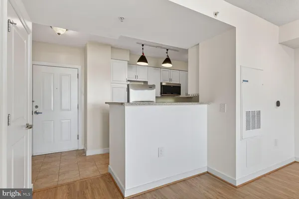 a kitchen with granite countertop a sink and a stove