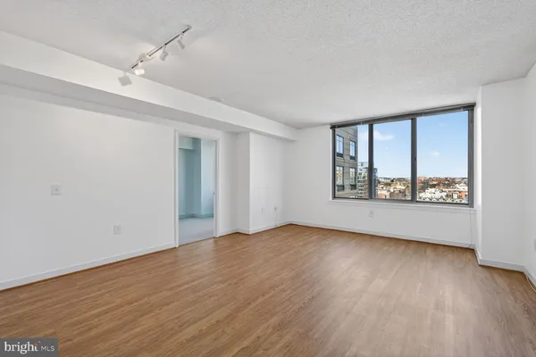 a view of kitchen with cabinets and wooden floor