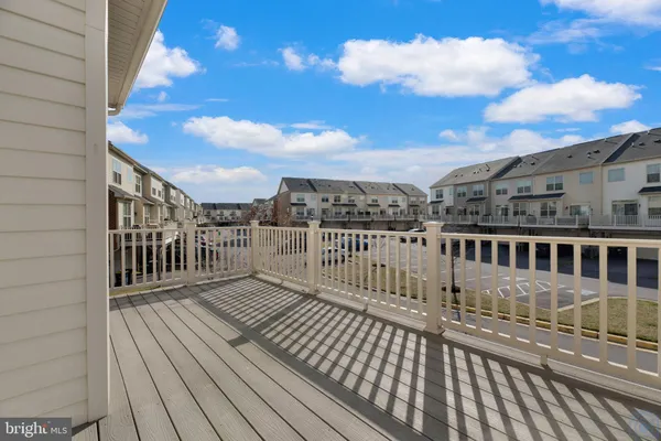 a view of a balcony with wooden floor