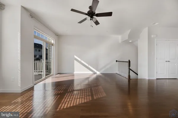 a view of an entryway with wooden floor