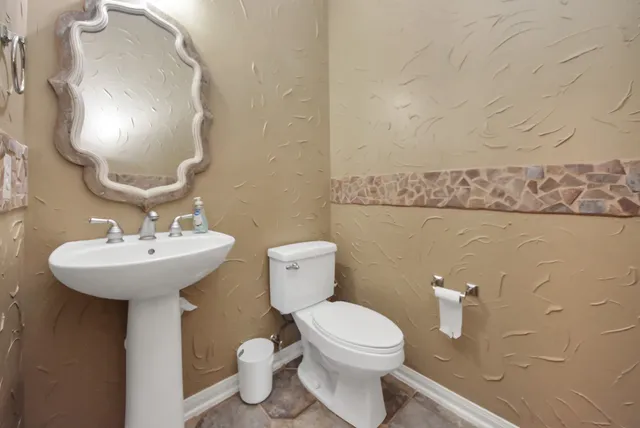 a view of a livingroom with furniture and a window